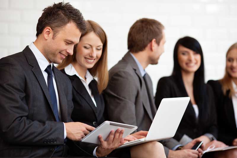 man and woman using computer