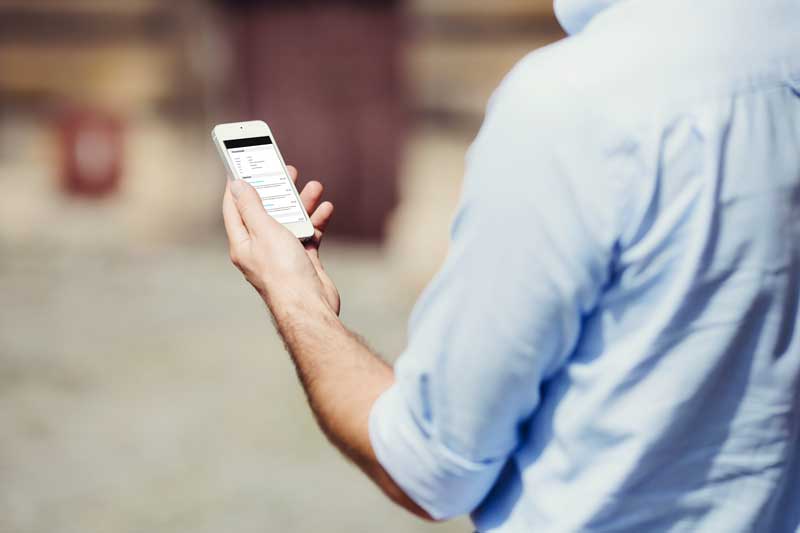 man holding mobile phone